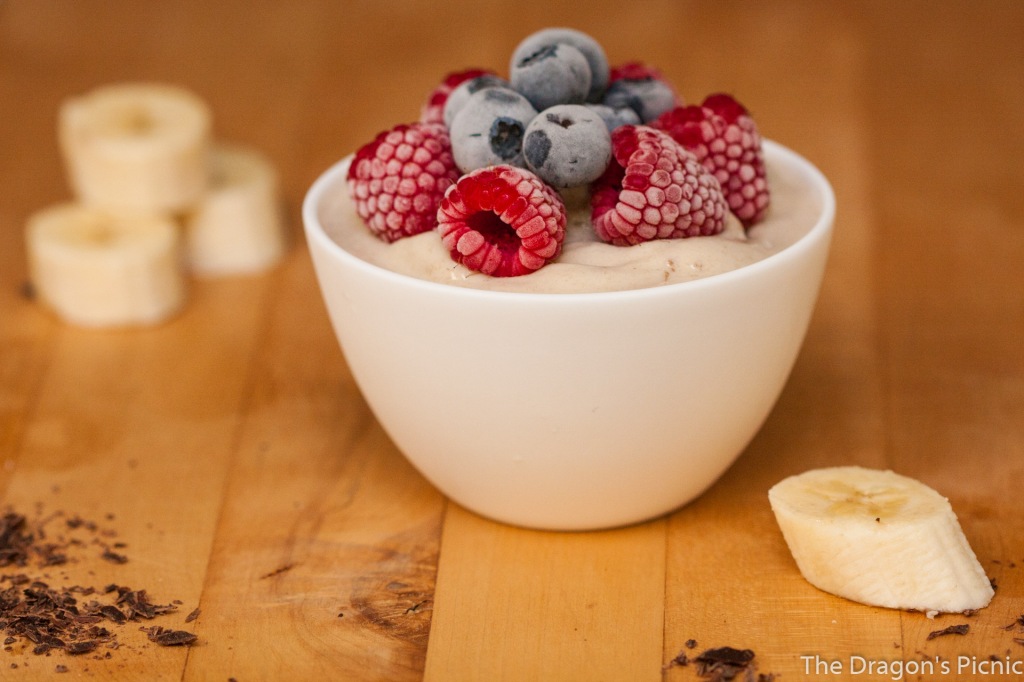 bowl of nice cream with frozen berries